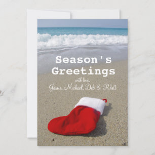 Santa Claus sock laying on beautiful beach Holiday Card