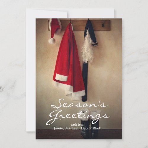 Santa costume with boots on coat hook holiday card