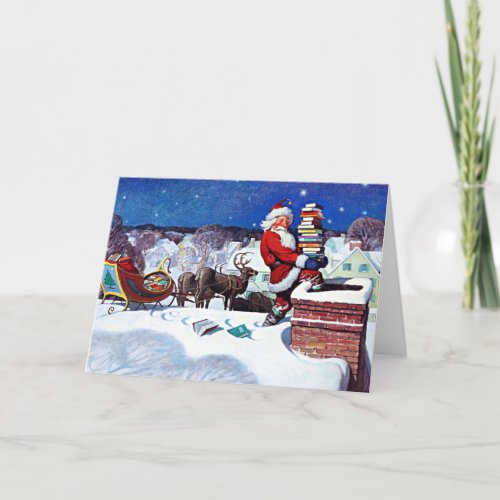 Santa going down the chimney with armload of books holiday card