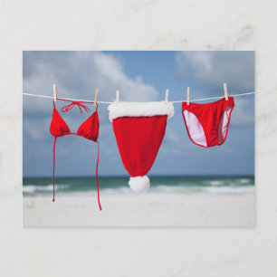 Santa hat and bikini on a clothesline holiday postcard