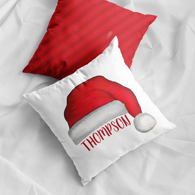 Santa Hat Personalized Family Name Christmas Throw Pillow (Personalized Santa hat Christmas pillow with custom family name festive holiday home decor accent.)