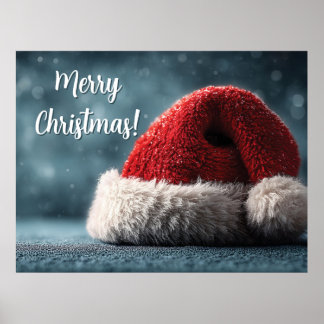 Santa Hat Resting on Snowy Surface with Greeting Poster