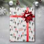 Santa Hat Siberian Husky Christmas Wrapping Paper<br><div class="desc">A beautiful Siberian Husky Dog wears a red and white striped Santa hat in the pattern on this Christmas wrapping paper. Along with the dog images are green holly sprigs with red berries, and red script text that says "Merry Christmas". The images and text are placed on a silver gray...</div>