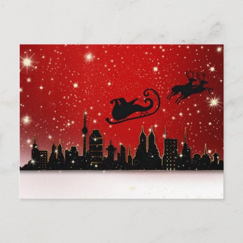 Santa over the city postcard