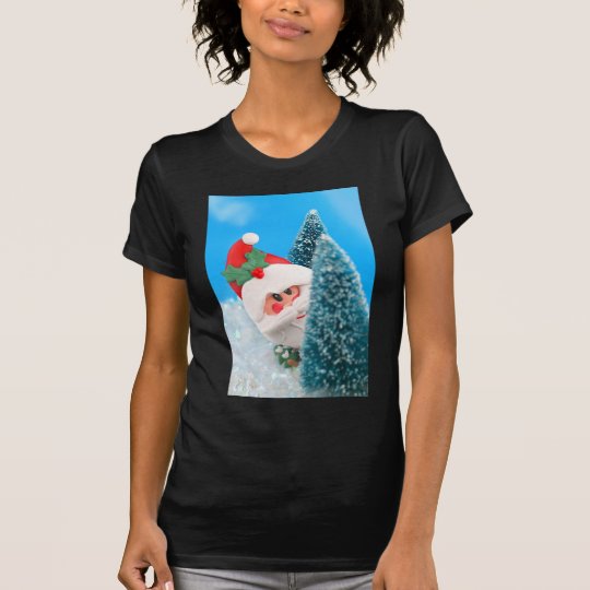 Santa peeking from behind a christmas tree T-Shirt
