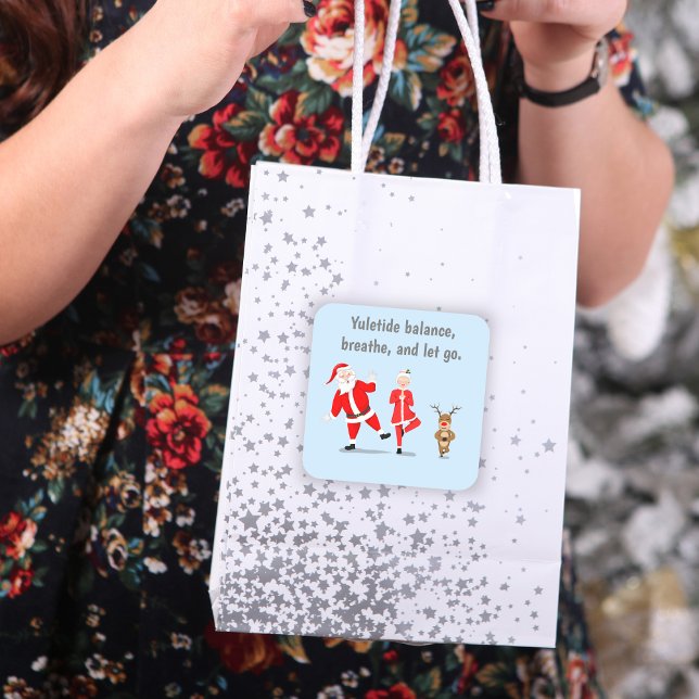 Santa Trying To Do Yoga With Mrs. Claus & Reindeer Square Sticker (A cute sticker to add to a gift bag, scrapbook or gifts!)