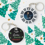 Santa's Favorite Pianist Photo Piano Key Black Keychain<br><div class="desc">Grand piano keys Christmas keychain for a piano player, pianist, student, teacher, musician, instructor, kids, friends, etc. Front part: A cute jingle bell outline image and snowflakes with an elegant script typography of "Santa's favorite pianist" in white, green and red color, on a black backdrop. Back part: A piano circle...</div>