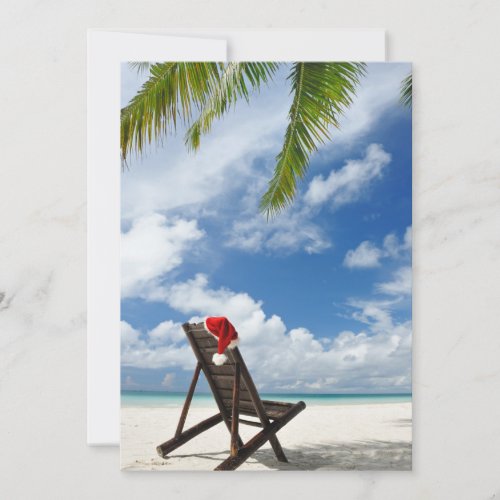Santas hat and chaise lounge on the beach holiday card