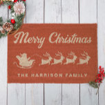 Santas Sleigh Merry Christmas Red Doormat<br><div class="desc">Fun seasonal red coir doormat for your Christmas season holiday decor with reindeers flying Santa's sleigh through the air,  "Merry Christmas" in a stylish vintage script and your family name in simple typography.</div>