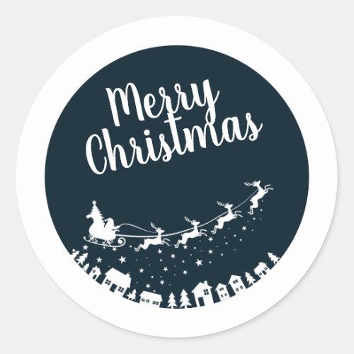 Santas sleigh silhouette flying above the houses classic round sticker