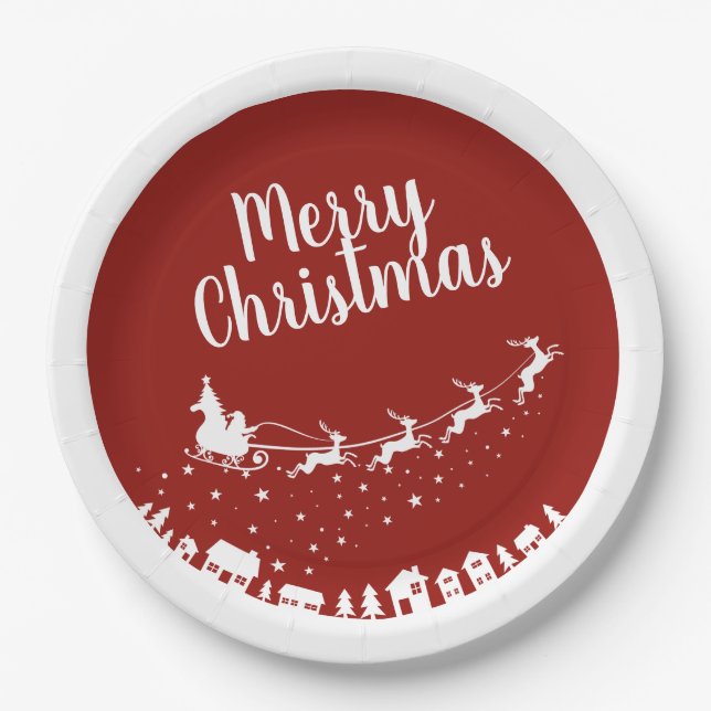 Santa's sleigh silhouette flying above the houses paper plates (Front)