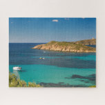 Sardinian blue sea and sky with boats and cliff jigsaw puzzle<br><div class="desc">Challenging puzzle featuring an original photograph of the transparent blue water of the Sardinian emerald sea in all shades of turquoise,  surrounded by green Mediterranean scrub with a little white boat and an islet in the distance</div>
