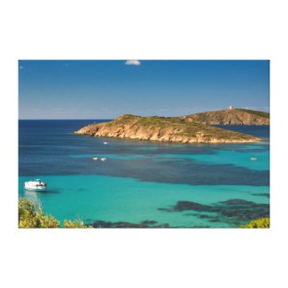 Sardinian clear blue sea & sky w/ boats and cliff