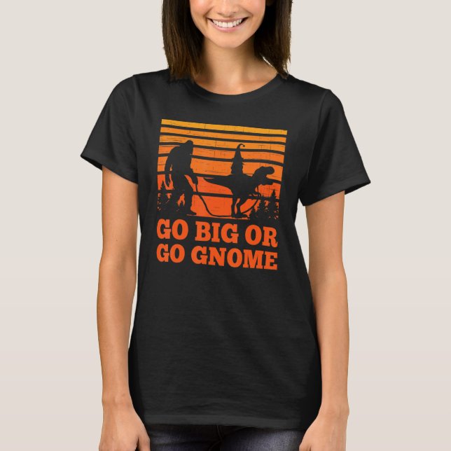 Sasquatch walking T-rex carrying a Gnome Go big Go T-Shirt (Front)