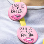 Sassy Lips Shut Up and Kiss Me Button<br><div class="desc">Add a playful touch to your style with this sassy "Shut Up and Kiss Me" pin button featuring a cheeky cartoon illustration of a woman's lips wearing vibrant magenta lipstick,  playfully biting her lips. This sassy accessory is perfect for expressing your bold and flirty side.</div>
