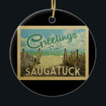 Saugatuck Beach Vintage Travel Ceramic Ornament<br><div class="desc">This Greetings From Saugatuck vintage postcard design features a sandy beach with a beautiful turquoise ocean water and above the sea,  a blue sky with billowy white clouds. In vintage travels style.</div>