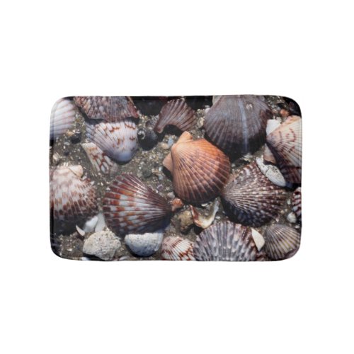 Scalloped Colorful Seashells On A Black Sand Bathroom Mat