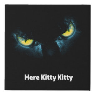Scary cat eyes on a black background faux canvas print