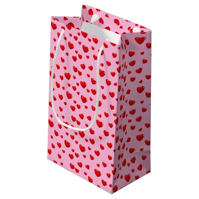 Scattered Red Hearts On Pink Small Gift Bag (Back Angled)