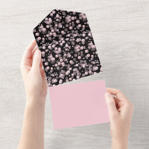 Scatterings of pink and white pearls on black velv all in one invitation