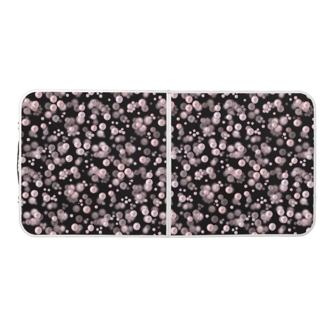 Scatterings of pink and white pearls on black velv beer pong table (Top)