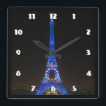 Scenic Eiffel Tower at Night Square Wall Clock<br><div class="desc">A scenic view from Paris,  France. The famous landmark,  the eiffel tower,  seen at night lit up by bright blue lights.</div>