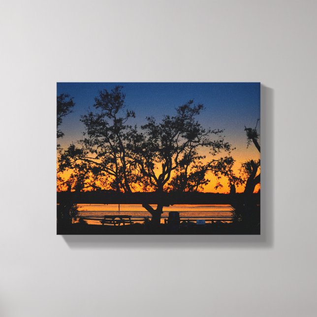 Scenic view of the sunset over the river canvas print (Front)