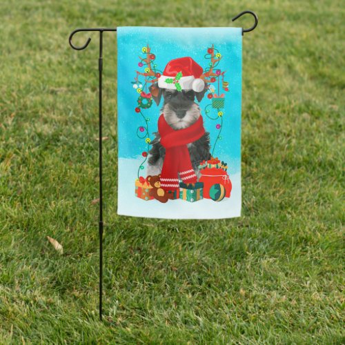 Schnauzer in snow with Christmas gifts  Garden Flag