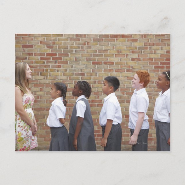 School children lining up in the playground for postcard (Front)