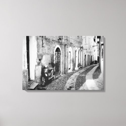 Scooter in a street in Italy in black and white Canvas Print