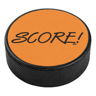 Score orange hockey puck