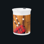 Scotland Bagpipe Tartan Plaid Musical Instrument Drink Pitcher<br><div class="desc">Scotland Bagpipe Tartan Plaid Musical Instrument Celebrate the rich musical heritage of Scotland with the "Scotland Bagpipe Tartan Plaid Musical Instrument." This artwork captures the beauty and tradition of the bagpipe, a beloved symbol of Scottish culture making it a perfect piece for any enthusiast.. Description: The image features a photograph...</div>