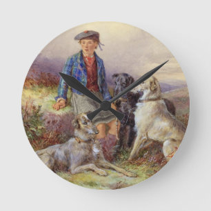 Scottish boy with wolfhounds in a Highland landsca Round Clock
