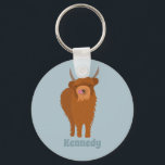 Scottish Highland Cattle Cow Graphic Personalized Keychain<br><div class="desc">Create a cute personalized accessory when you add a name to this keychain. It features a cute illustration of a Scottish Highland Cow with its tongue out set against a pale blue background. Your name or other text appears below the graphic in coordinating blue lettering.</div>