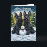 Scottish Terriers and Snowman Christmas Card<br><div class="desc">Send warm holiday wishes with this charming Christmas card featuring two adorable Scottish Terriers sitting proudly beside a cheerful snowman in a snowy winter wonderland. Behind the Scottish Terriers, the sun sets behind snow-covered trees and a golden glow fills the sky, creating a peaceful and festive atmosphere. With gently falling...</div>