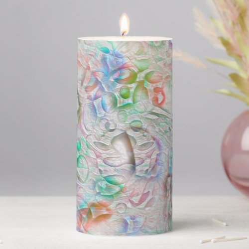 Scratched pixels in colored texture over off_white pillar candle