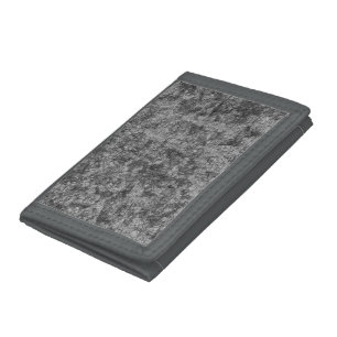 Scratches on a lightly spotted grey to black tri-fold wallet