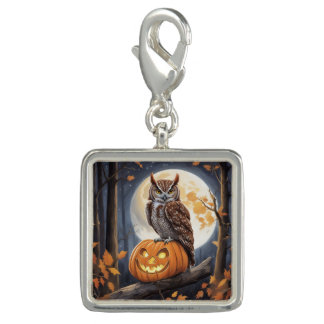 Screech owl sitting on jack-o-lantern charm