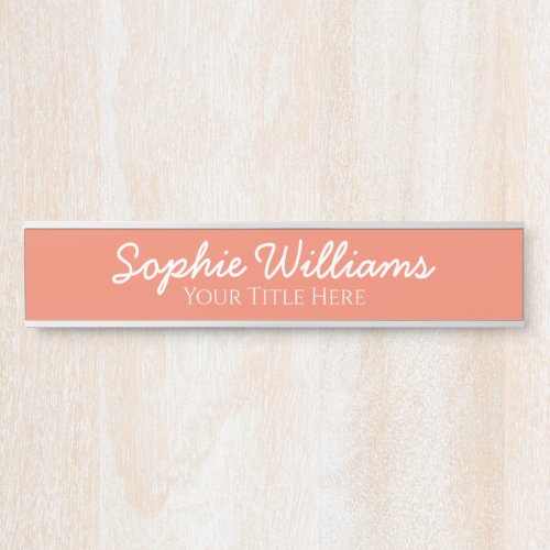 Script Bold White Fonts Name Title on Salmon Pink Door Sign