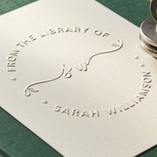 Script heart initials from the library of book embosser