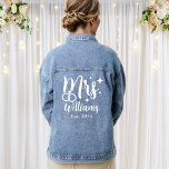 Script Mrs Wedding Established Date Bride Jean Denim Jacket<br><div class="desc">Personalized bride jean denim jacket with the bride's surname and the established or wedding date. Design with wedding rings,  white text,  a modern script font,  and a large "Mrs" text. Also available with black text.</div>
