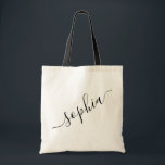 Script Name Personalized Modern Simple Tote Bag<br><div class="desc">Chic personalized labeled reusable canvas tote bag with custom name text for bridesmaid gifts, bachelorette parties, birthday favors, and girls trip keepsakes, and graduation gift for cute college and dorm room storage. Perfect for sports and hobby gear storage and transport. Colors and fonts are editable, just click “customize further” to...</div>