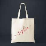 Script Name Red Personalized Modern Simple Tote Bag<br><div class="desc">Chic red personalized labeled reusable canvas tote bag with custom name text for bridesmaid gifts, bachelorette parties, birthday favors, and girls trip keepsakes, and graduation gift for cute college and dorm room storage. Perfect for sports and hobby gear storage and transport. Colors and fonts are editable, just click “customize further”...</div>
