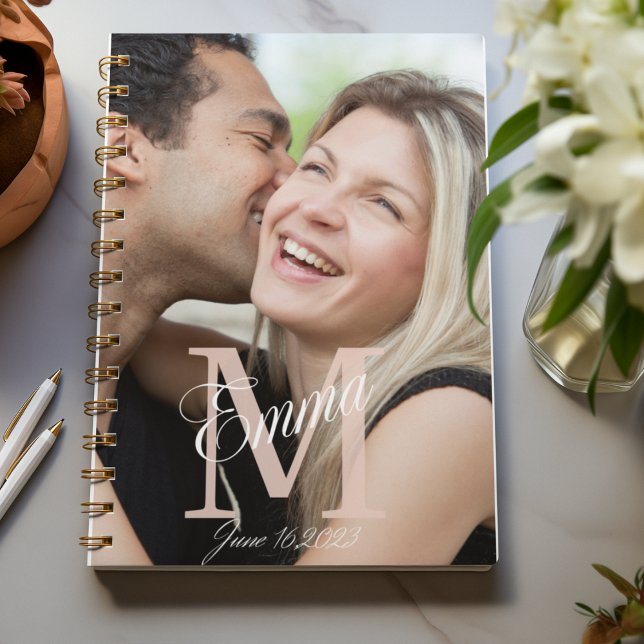 Scripted Overlay Story Notebook (“Romantic notebook design with photo backdrop, bold serif initial, script overlay, and subtle date.”)