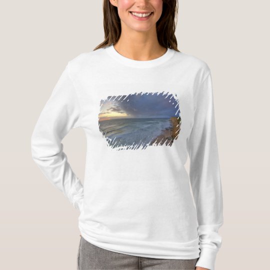 Sea cliffs catch days last light at Pomponi T-Shirt