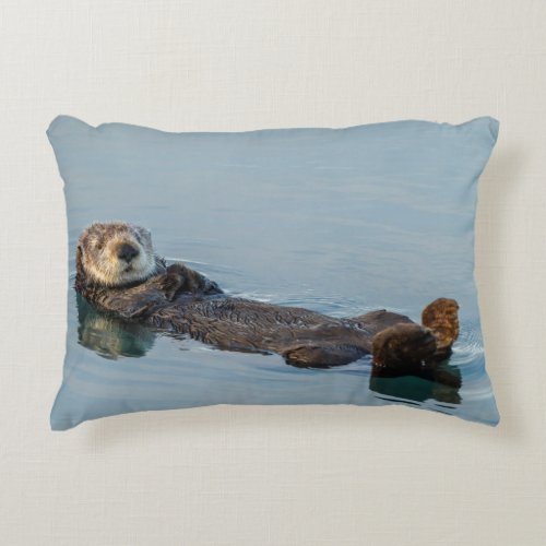 Sea otter floating on back in ocean accent pillow