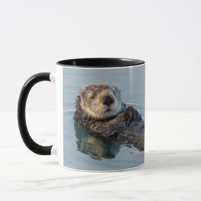 Sea otter floating on back in ocean mug (Left)