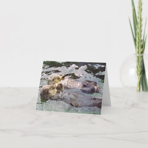 Sea Otters Holding Hands Card