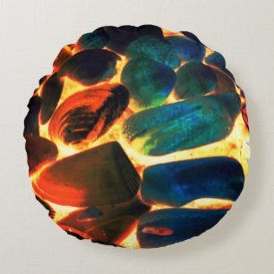 Sea oyster shell on flaming volcanic lava or fire round pillow
