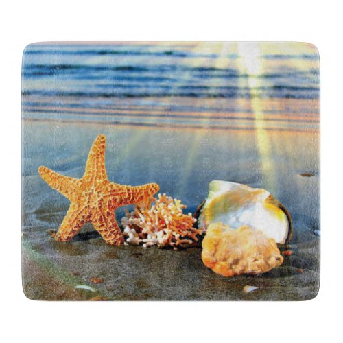 Sea shells and starfish on beach cutting board